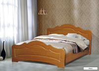 Кровать двойная с фигурной ножной спинкой